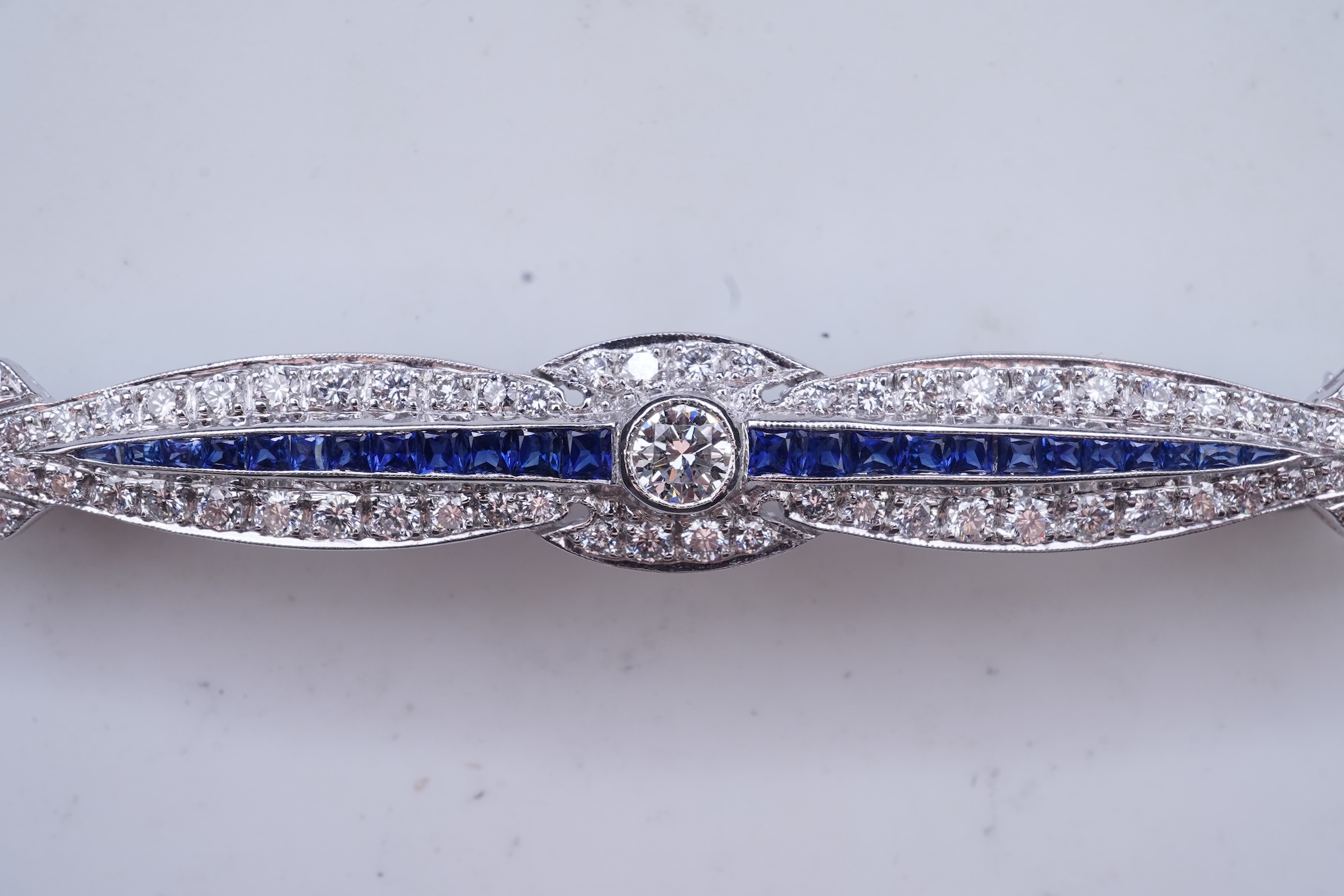 A sapphire and diamond bar brooch